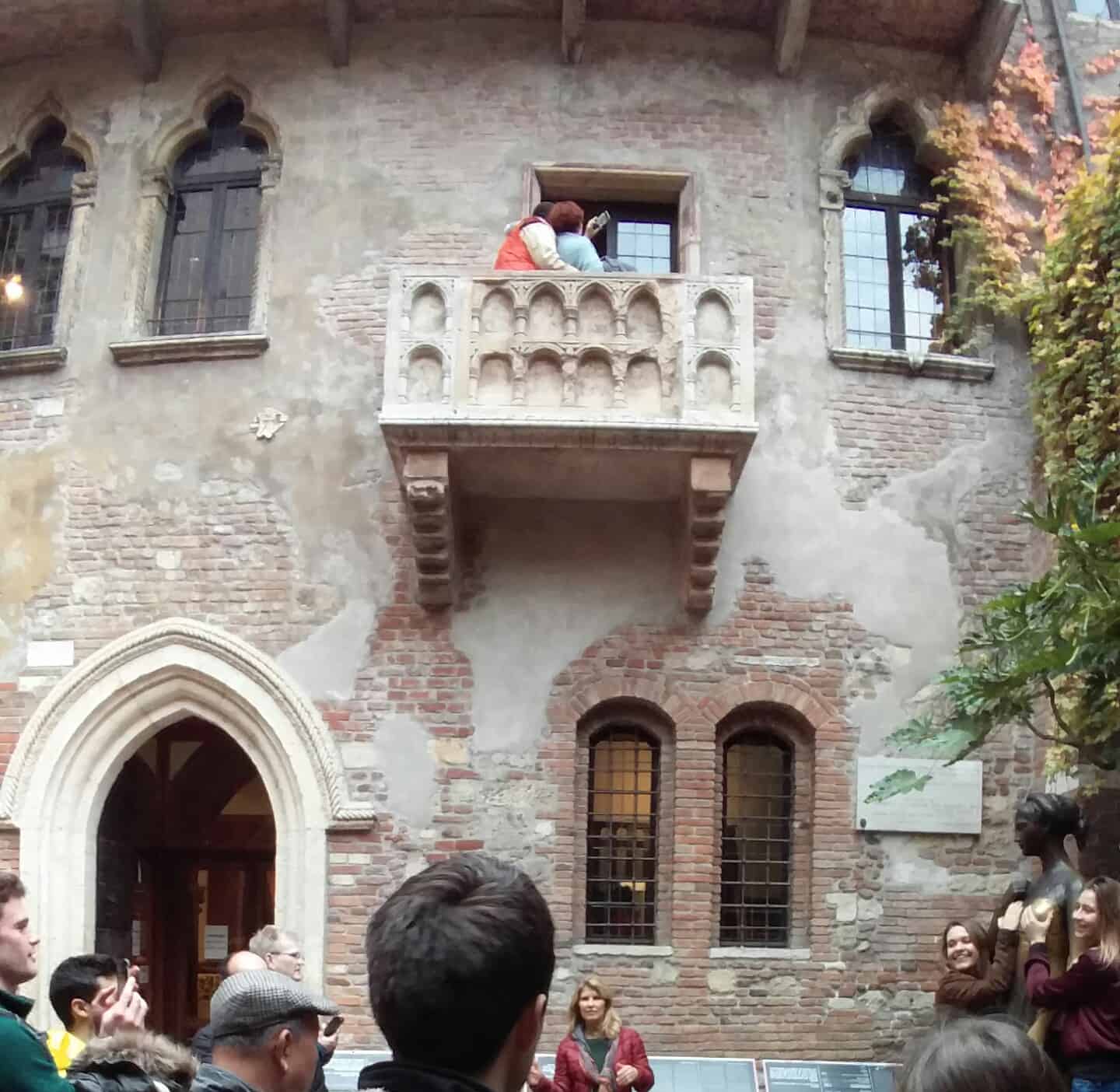 Tourists gazing up at Juliets balcony Verona