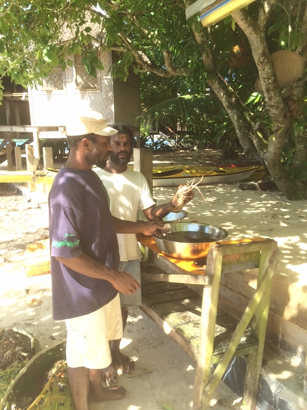 Another picture of the kitchen staff preparing our lobster at Nusa Island Retreat.