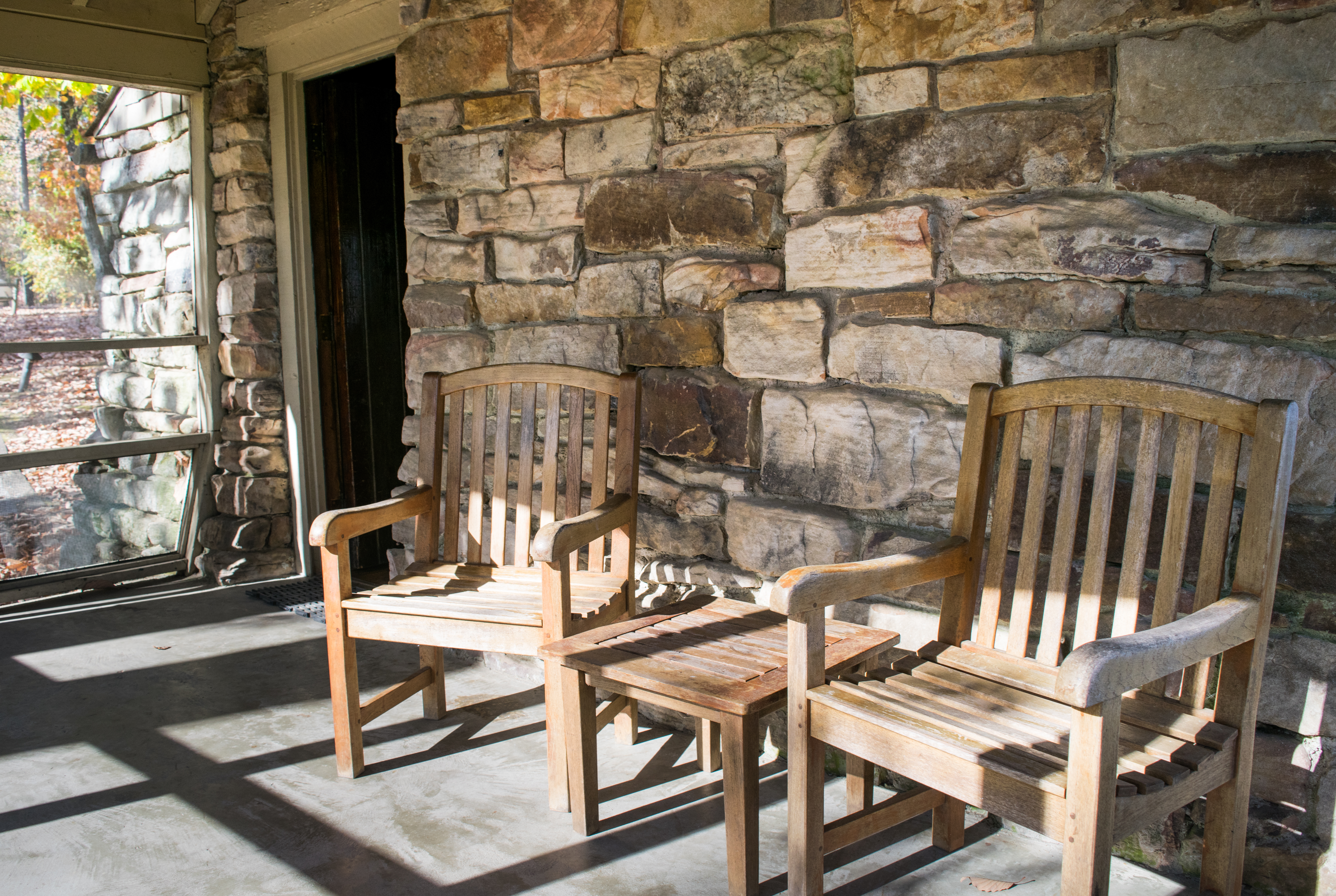 Rocking Chairs on Screened Porch at Rustic Cabin Monte Sano State Park